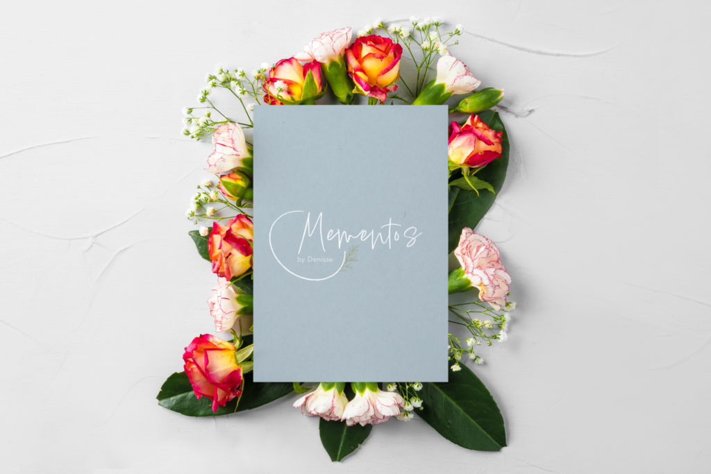 Logo design mock up surrounded by flowers.
