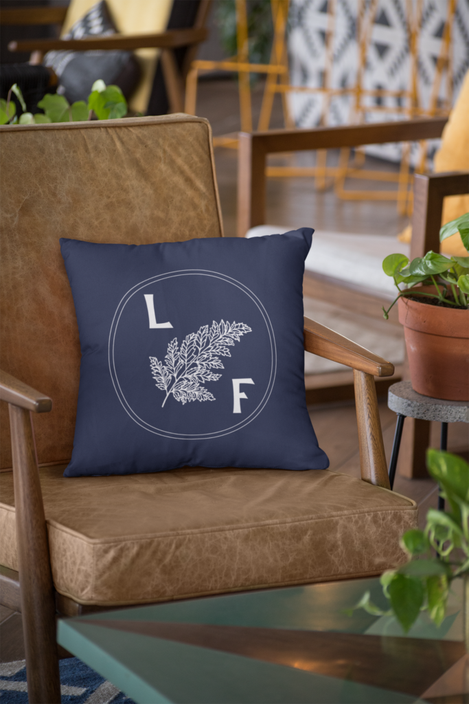 Laura Fratkin logo design on a pillow