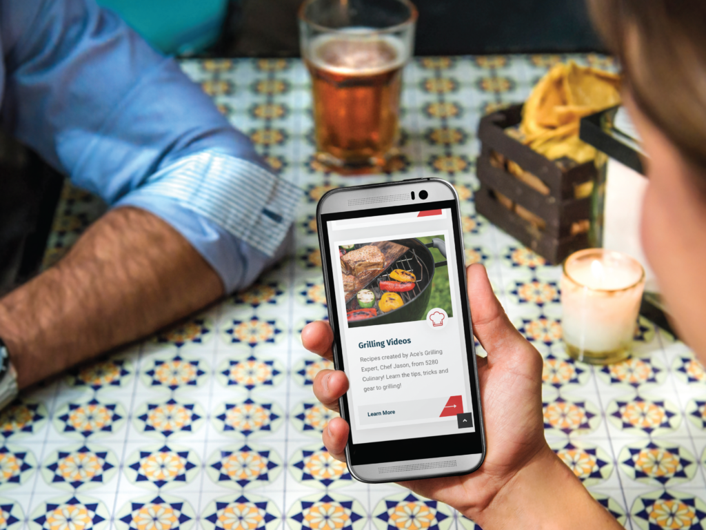 A phone displaying thegrillingstoresd.com